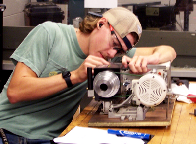 Student using benchtop mini lathe