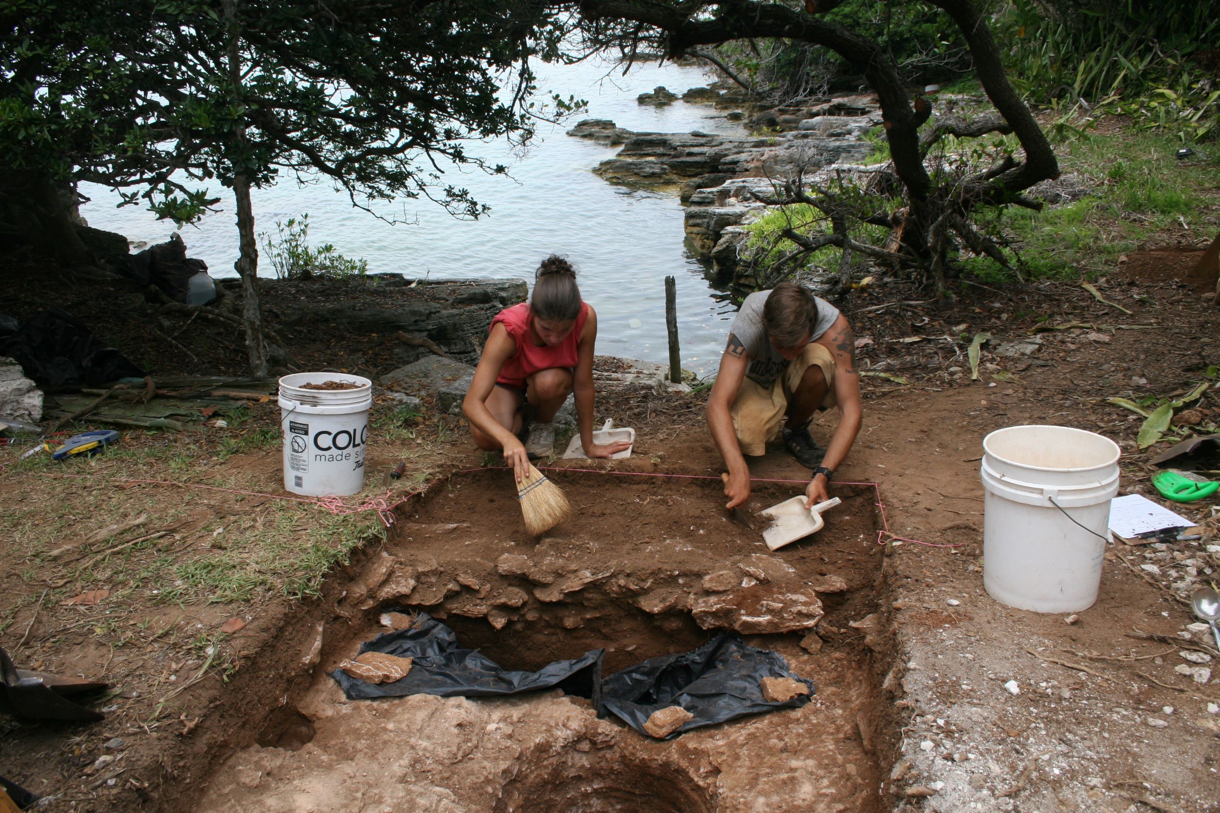 students excavate pit