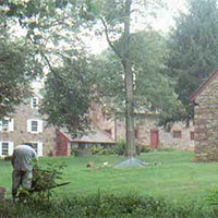 Archaeologists conduct testing in the Elizabeth Plantation. With 13 original buildings constructed between 1746 and 1788, and no subsequent construction since that time, this site represents one of the best preserved large-scale groupings of 18th century buildings in the United States.