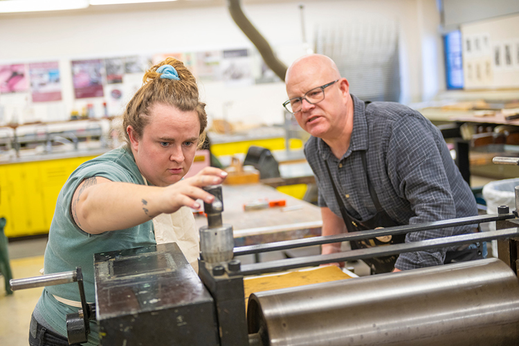 Faculty and student working together
