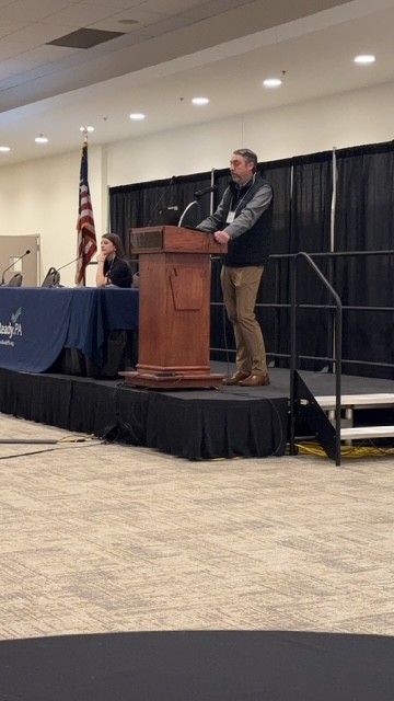 Standing is MSEM Graduate Taylor Griffiths, seated is MSEM Graduate Sarah Schmidt, during their presentation at the PEMA Symposium