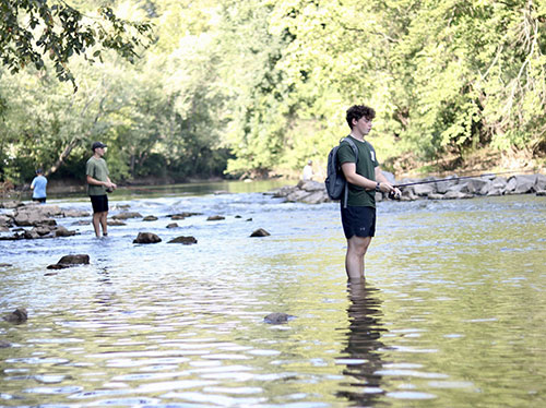 People fishing in the Conestoga River