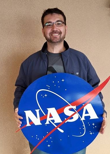 Jason Zimmerman with NASA sign