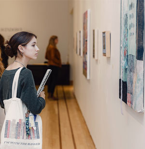 A student study art in the Eckert Art Gallery
