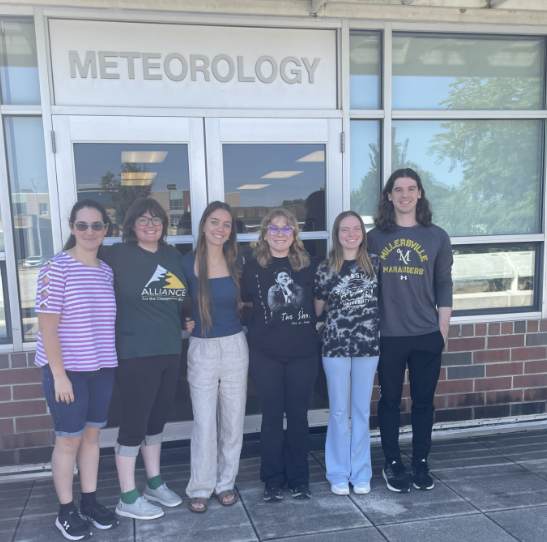 Summer 2026 student interns in group picture on the weather center's obs deck.