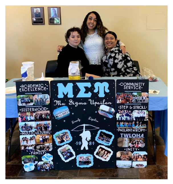 Three members of MU Sigma Upsilon Sorority at a table in the Student Memorial Center
