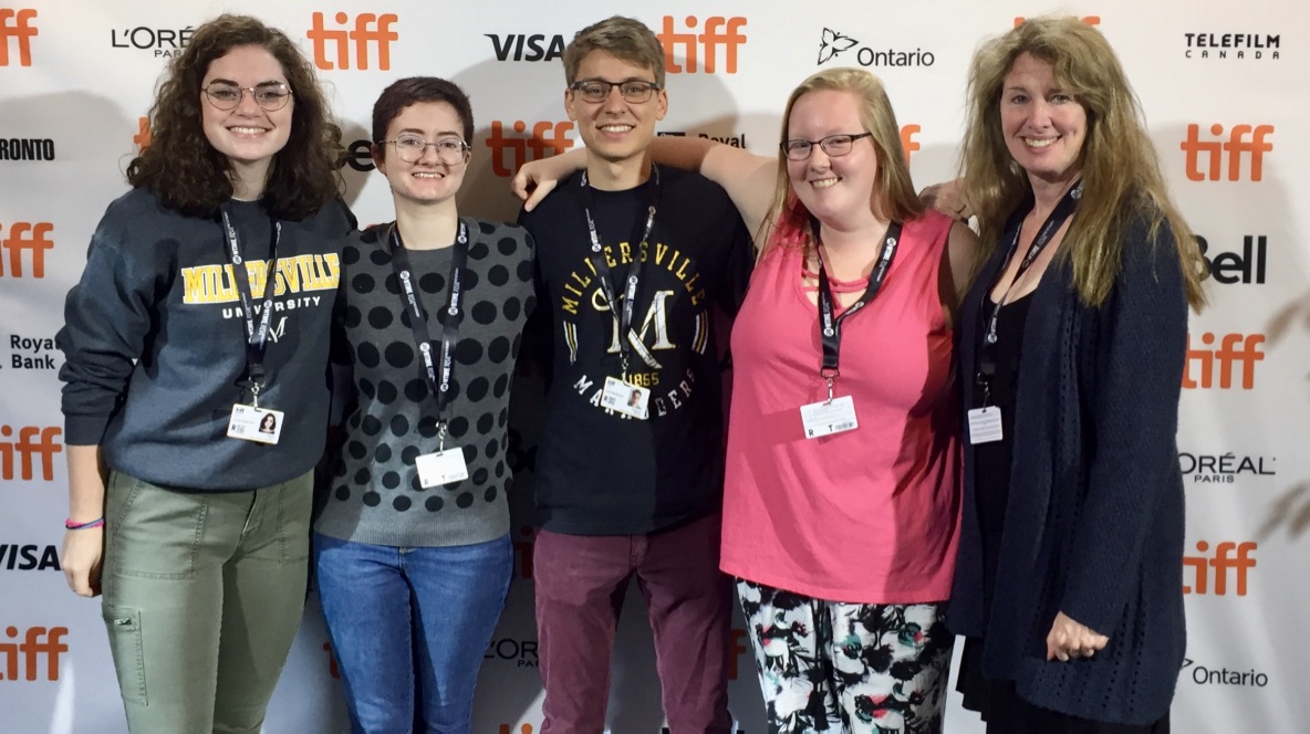 Students and professor pose for a picture