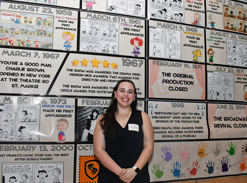 Female student standing in front of her research project