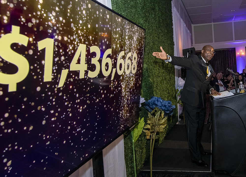 Dr. Wubah presenting One Day Give fundraising total of $1,436,668.