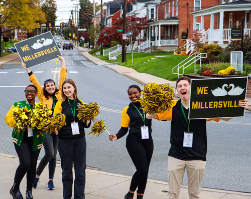 Students holding signs that they love Millersville