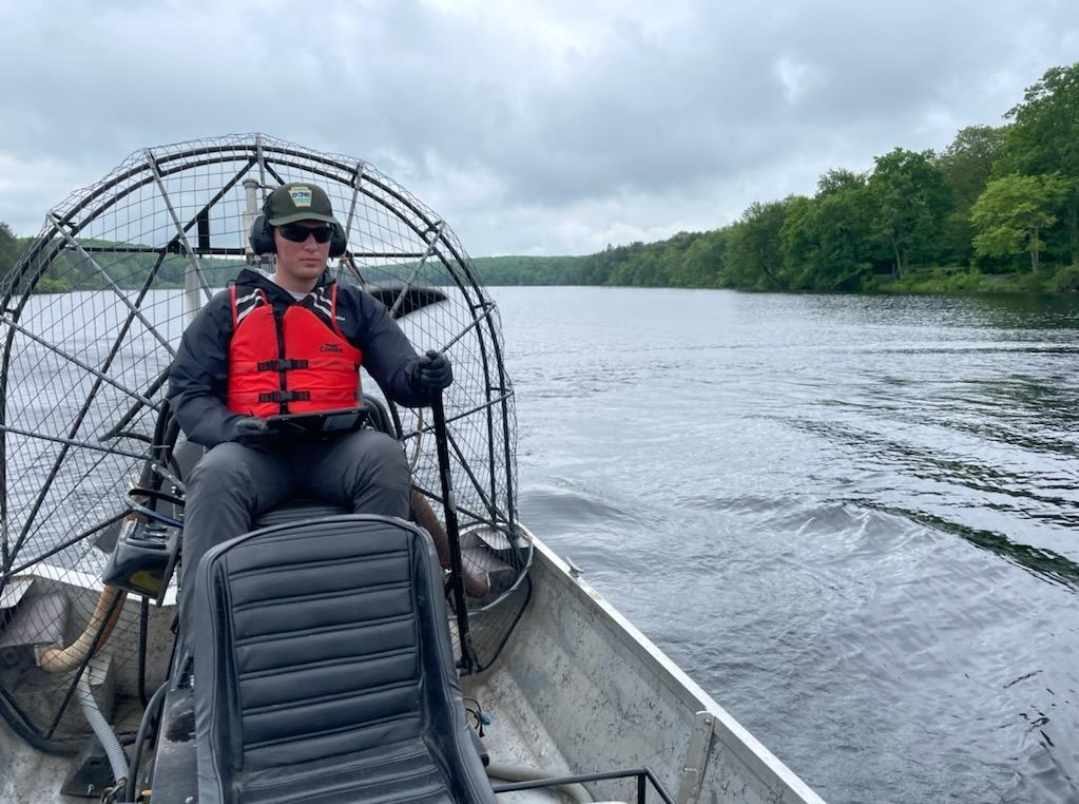 Ben driving an airboat with DCNR