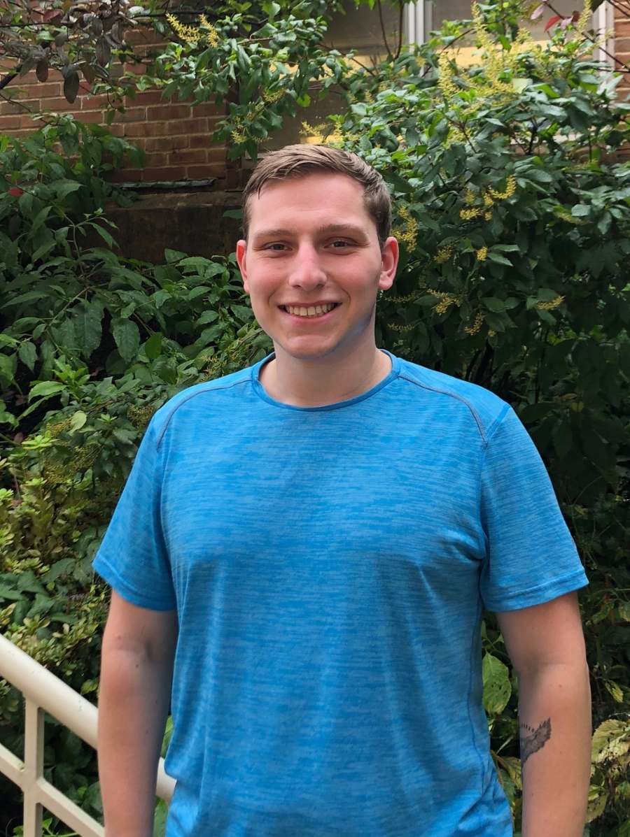 Colin standing outside Caputo Hall