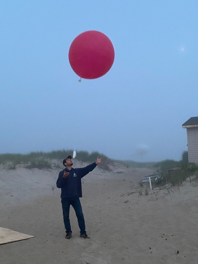Evan launching weather ballon.