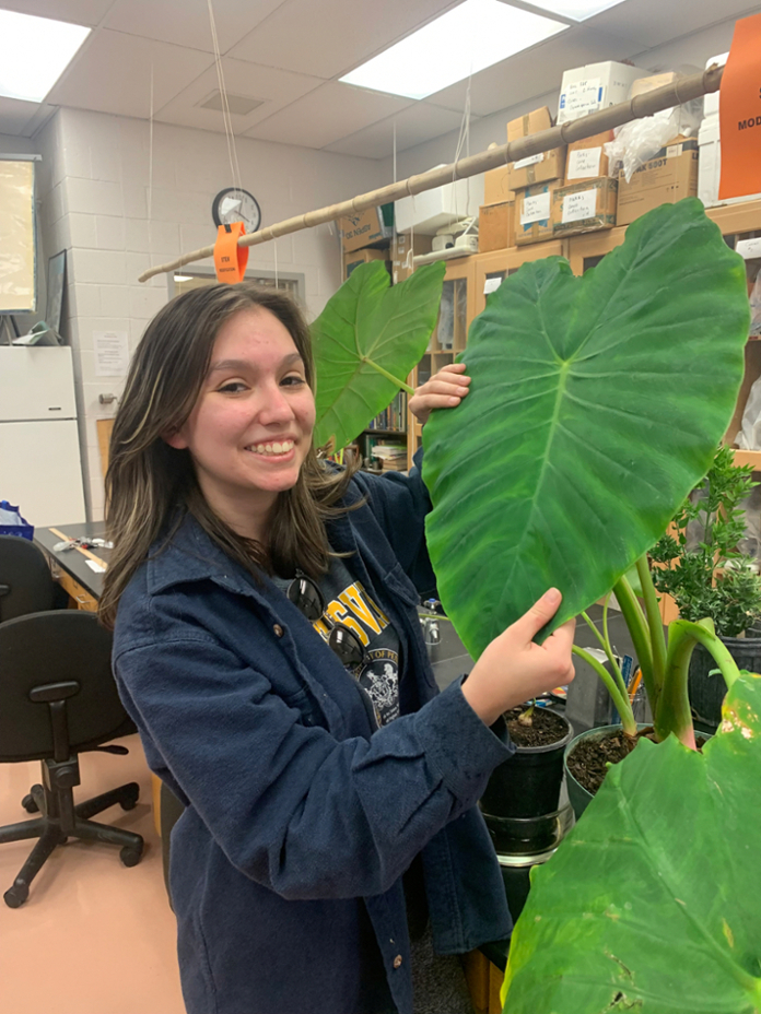 Lauren with Banana Tree in her Botany Lab
