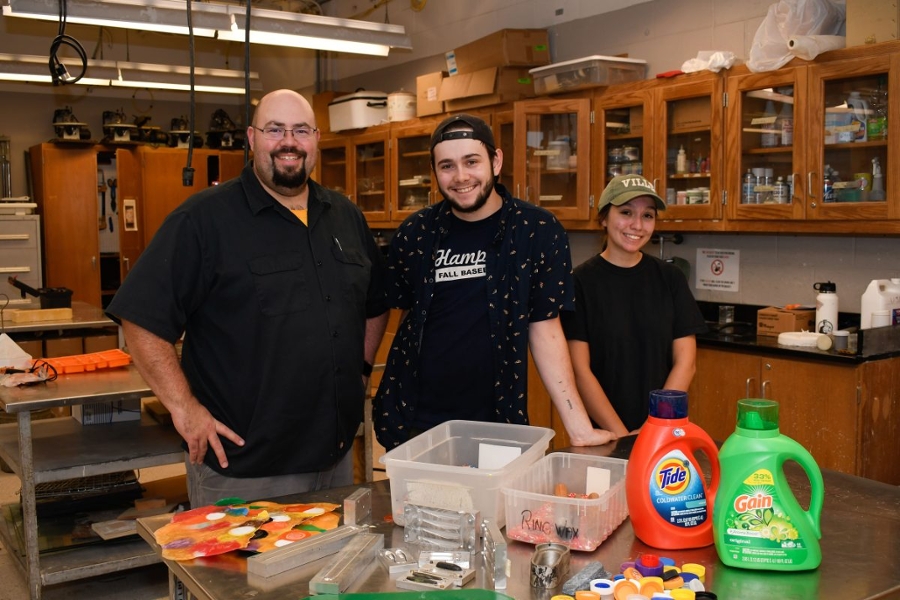 Manusos, Lauren , and classmate Jackson Harral at the COT presentation on plastics recycling. 