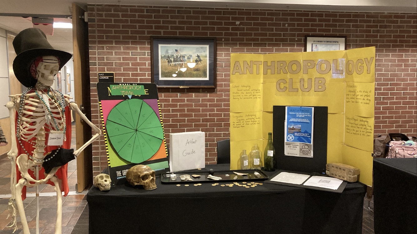 Indiana Bones stands with the Anthro Day display
