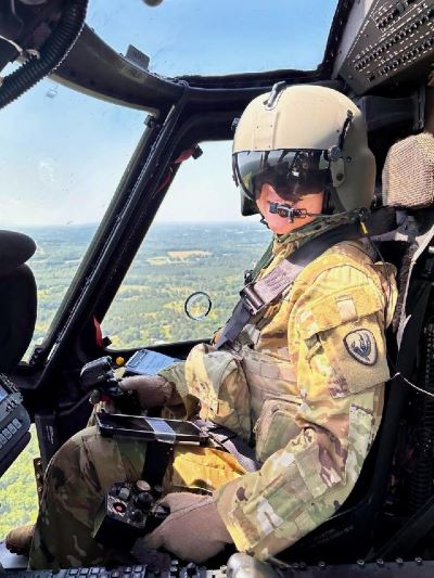 Blackhawk pilot Faith Willenbrock seated in cockpit