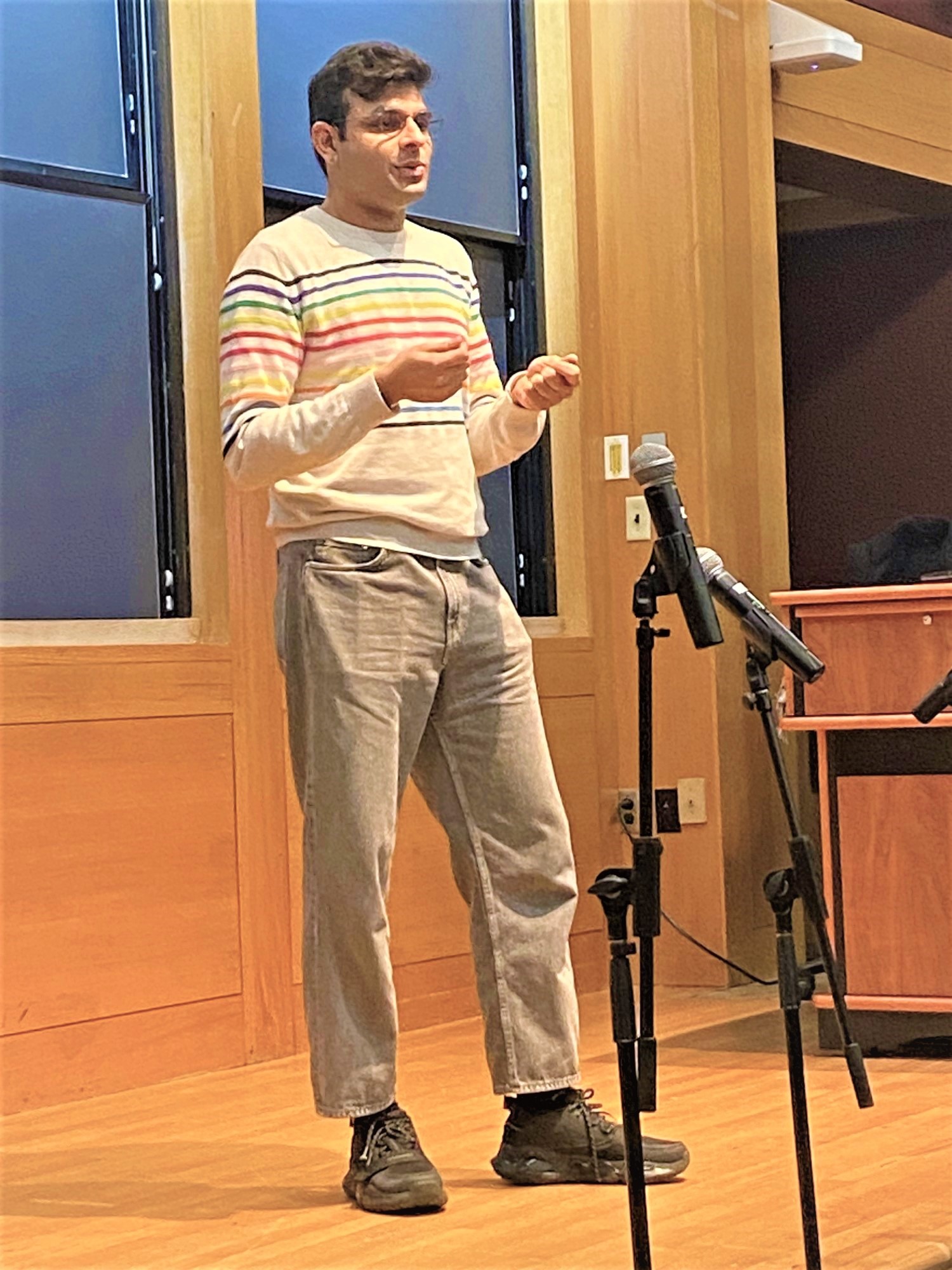 Udai Bhardwaj speaks on stage of Myers Auditorium