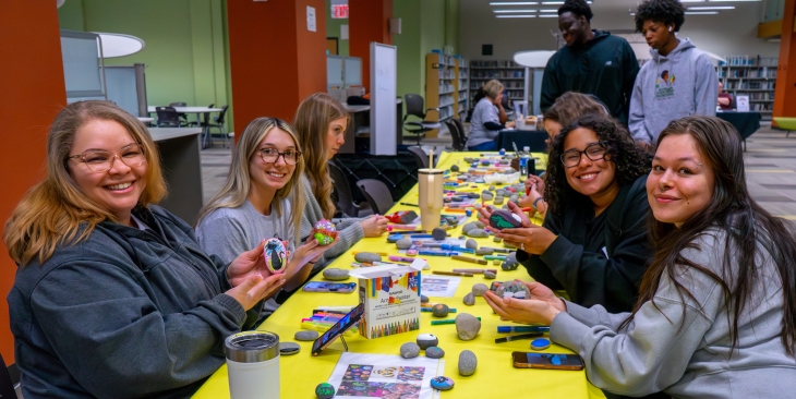 Students painting rocks at the Finish Strong event in Spring 2026