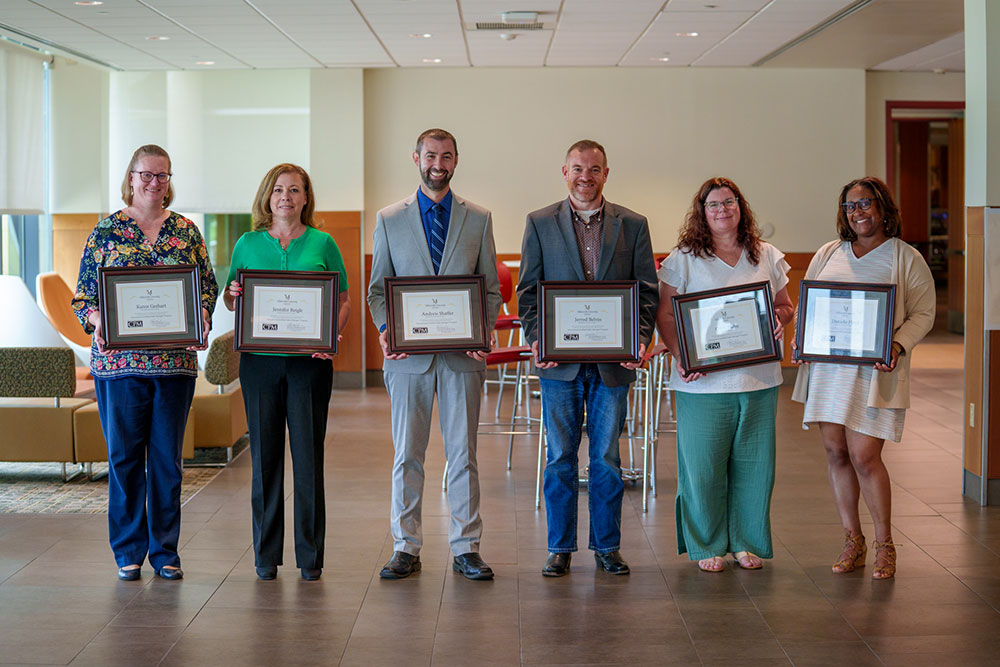 CPM Graduates display their awards