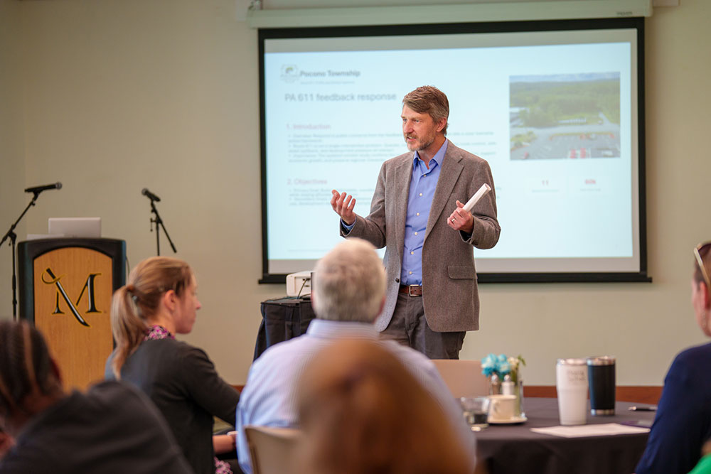 Dr. Andy Welaish explains capstone process to the audience