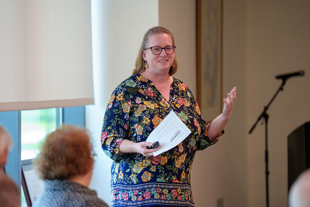 Close up of Karen Gerhart presenting to the audience